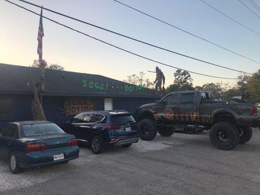 Outside. Plenty of parking for all size vehicles