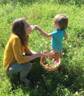 Steph and son picking herbs