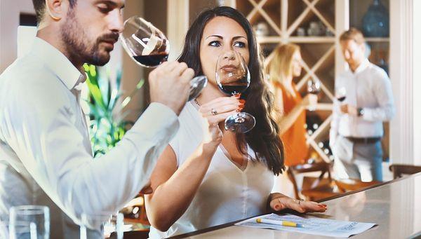 Guests smelling wine before tasting at Mile High Wine Tours in Denver, Colorado.