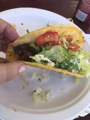 Asada grilled taco. Delicious! Has melted cheese and cotija