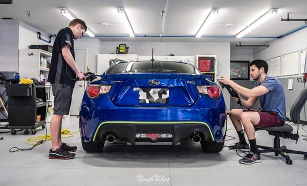 The guys working hard at polished up a Subaru BRZ.