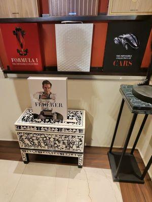 Display of Assouline's, "Impossible Collection" book series.