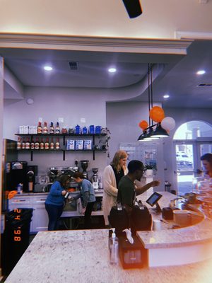 Coffee shop counter and staff