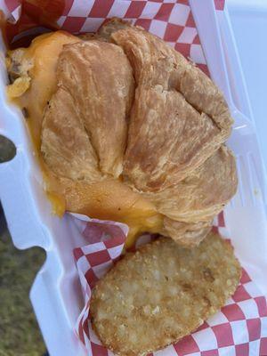 Egg and cheese croissant with hashbrown