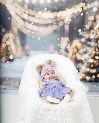 winter Christmas outdoor forest white snow land background with a 2 month old