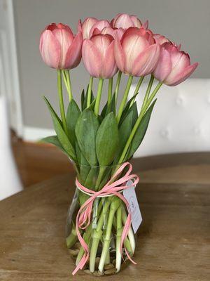 Coral pink tulip bouquet with pebbles