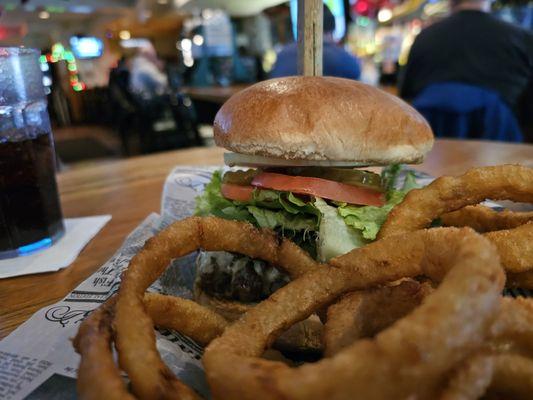 Almost World Famous 1/2 lb McNasty Burger with pepper jack cheese, onion rings, and a soda.