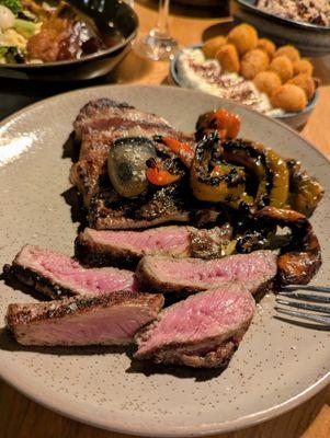 New York Strip. $49. Jimmy Nardello peperonata, crispy potatoes, black garlic + shoyu butter.