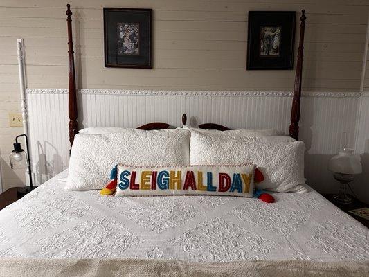 King size bed with a cute Christmas pillow.