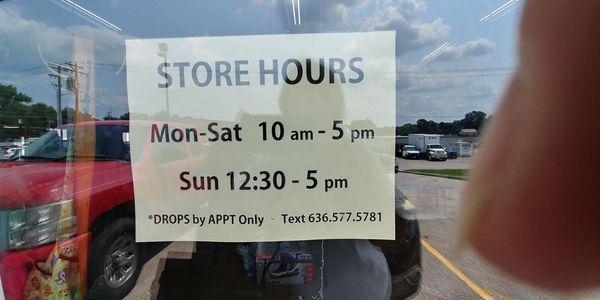 Hours posted on side window.