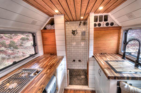 Full size shower with porcelain tile - toilet pulls out of the wall so you dont have to shower with your toilet