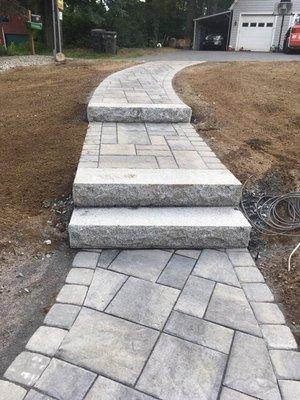 Redirected walkway from street to house, eliminating unnecessary extra steps.