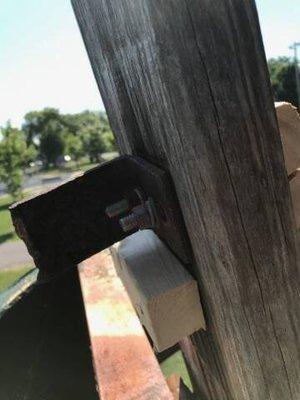 The bench in the dunk tank, split wood and falling apart.