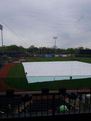 Pulling up the tarp from the rain delay!