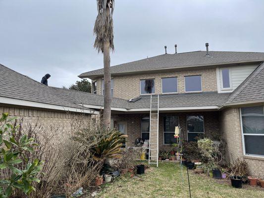 Completing the roof installation.