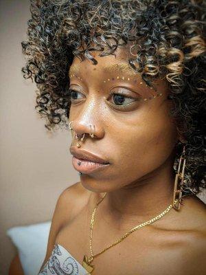 Multiple nose piercings, a septum piercing and a lip piercing. Almost Famous Body Piercing in Mankato, Minnesota.