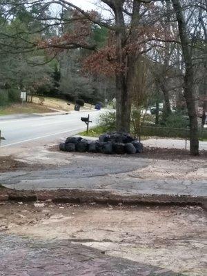 Bags of leaves from neighbor on the right. Leaves have been there for a month.