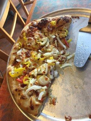 Tomato and bacon pizza with banana peppers and onions added