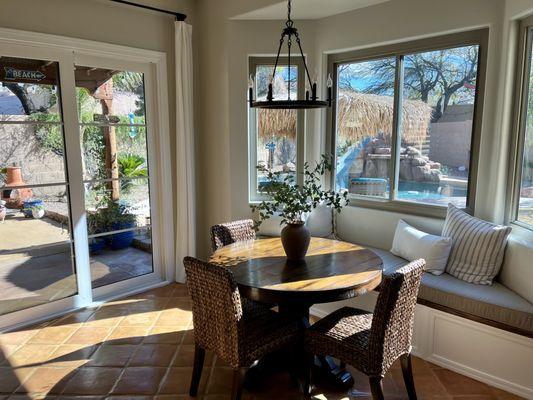 Sliding French doors in white in interior and bronze exterior. Bay windows are new from Aniin.