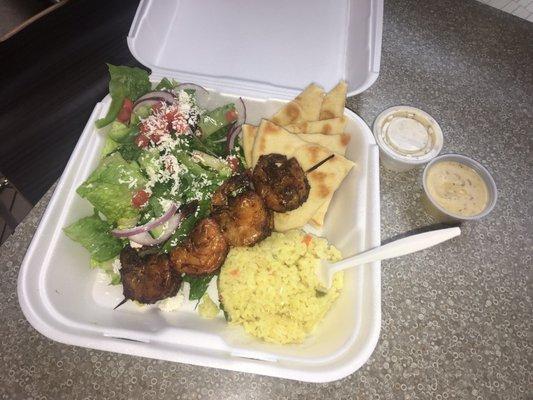 Shrimp platter with side salad and rice