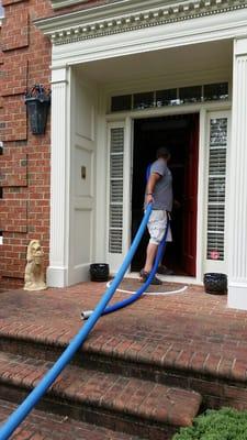 Loading the hose into the house