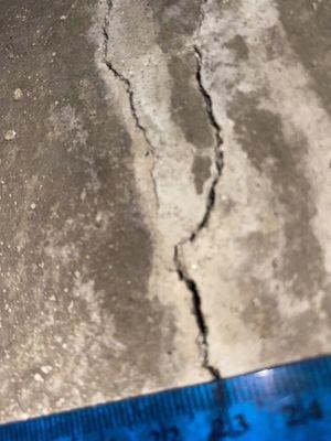 Cracked foundation - fixed with sealant, despite the size and length of the crack needing more serious repair.