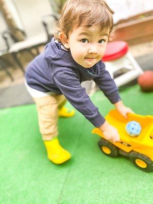 Toddler playing outdoors