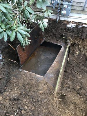 Underground oil storage tank removal - they hide them, we find them! Note the gas service right next to this abandoned UST...