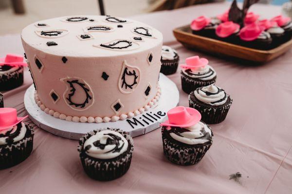 First rodeo themed Marble cake with Bavarian cream and raspberry jam filling. Cupcakes I handmade.