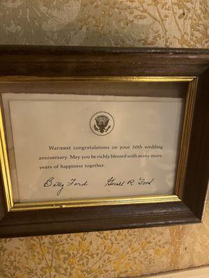 Plaque signed by Betty Ford wishing the Family a happy 50th wedding anniversary .