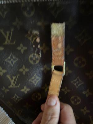 Glued Strap on LV bag...