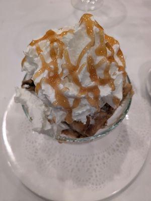 Homemade bread pudding with vanilla ice cream, whipped cream and caramel drizzle.