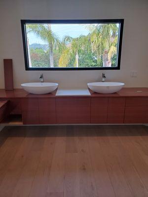 Remodel of master bathroom floating cabinets with vessel sinks.