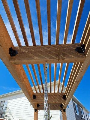 Pergola with hanging chairs..