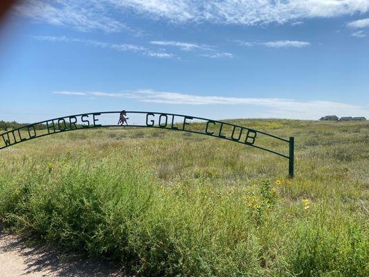 Wild Horse Golf course entrance with club house in background