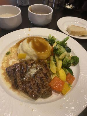 Steak was cooked to order. Mashed potatoes and gravy and veggies were great.