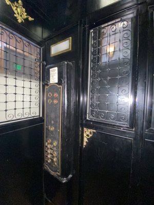 Period elevator inside the The Victor Hotel.