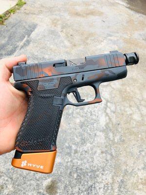 Glock, cerakote, stipple, laser engraving, custom guns, gun smith, gun store, gun shop, frame modifications