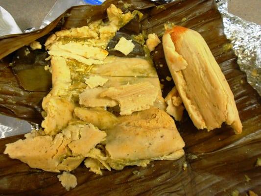 Chicken Tamale on (L) is wrapped in banana leaf.  Chili Cheese on (R) is corn husk.  Find the right lady, she has short hair