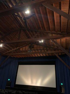 Inside theater beautiful wood beams/trestle ceiling