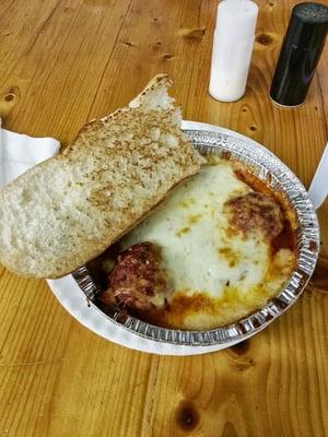 This is my favorite thing to get here, manicotti dinner. Two huge home made meatballs and stuffed shells, and bread. Super cheap