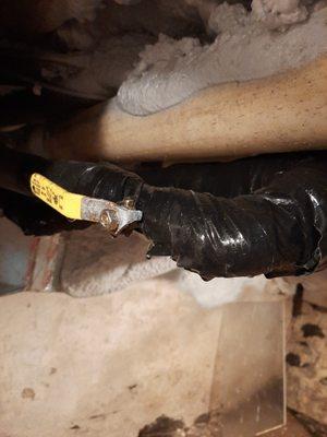 Another pipe that leaked coolant all over the basement, still held together with duct tape.