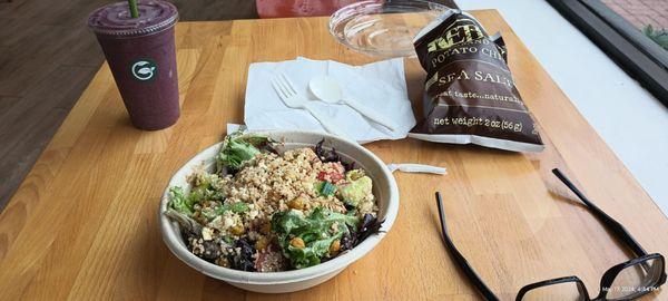 Mediterranean salad, chips, and smoothie.