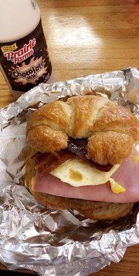 Ham, Bacon, Sausage, Egg, and Cheese Croissant. Chocolate "Long Boy" donut filled with Bavarian Cream. Chelate milk. Great breakfast!