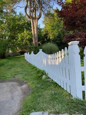 Cedar spaced Picket Fence Stained White