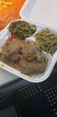 Salisbury steak over gravy & rice. Green beans & collard greens