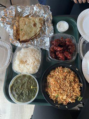 Garlic naan (top left), white rice, saag paneer (bottom left), crispy honey chicken (middle right) and chicken biriyani (bottom right)