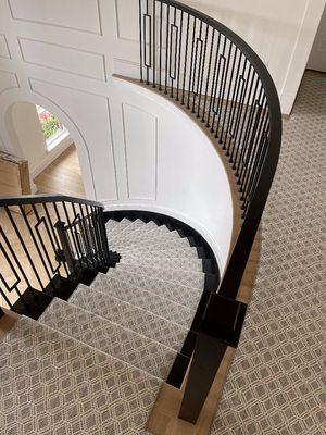 Pattern carpet on circular steps designed and installed By Aladdin Carpet & Floors