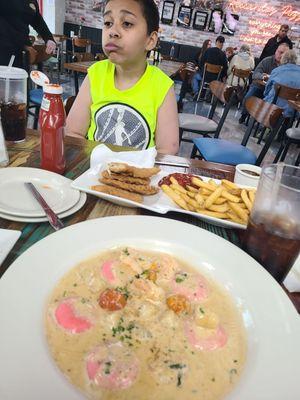 Lobster ravioli and chicken tenders with fries