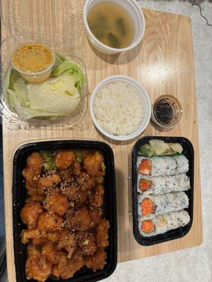 Sesame chicken (with side salad, miso soup and white rice), spicy kani roll, spicy shrimp roll.